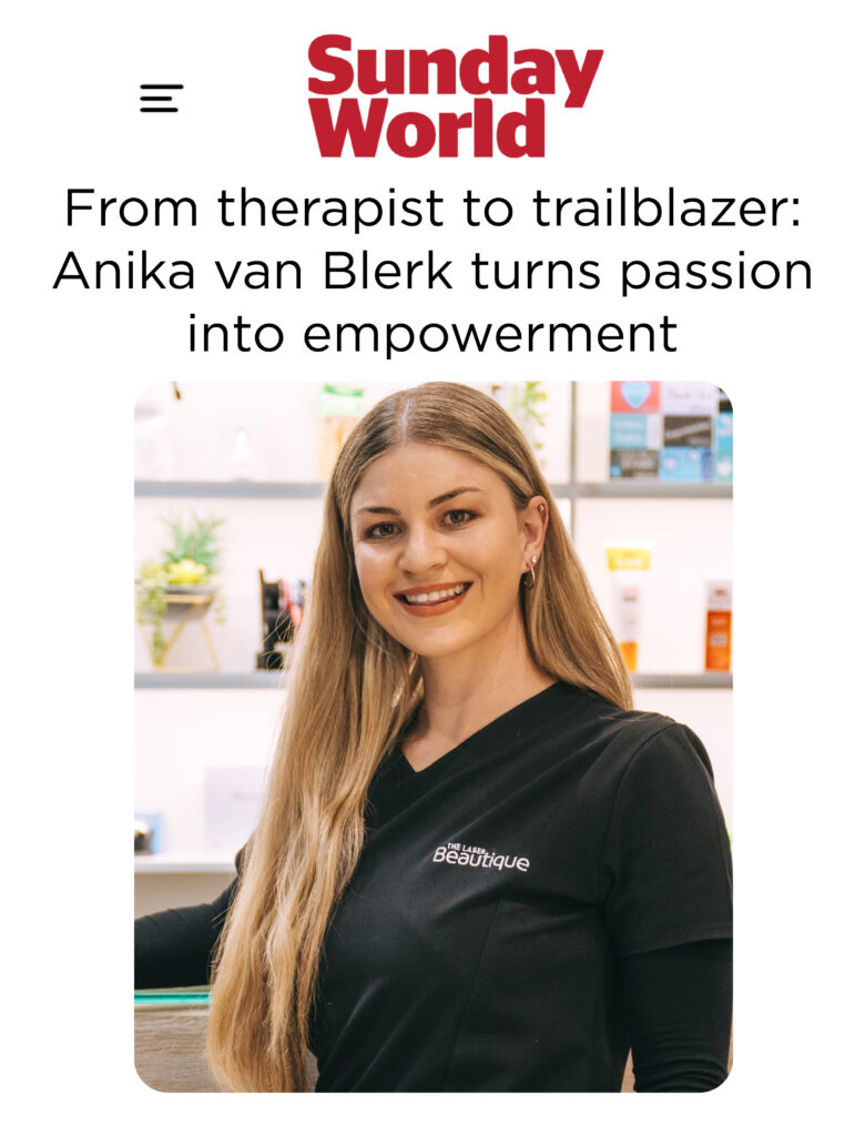 Anika Van Blerk posing by The Laser Beautique's reception area with pride and empowerment