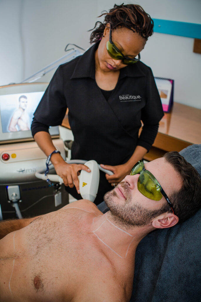 A man getting his chest lasered at The Laser Beautique