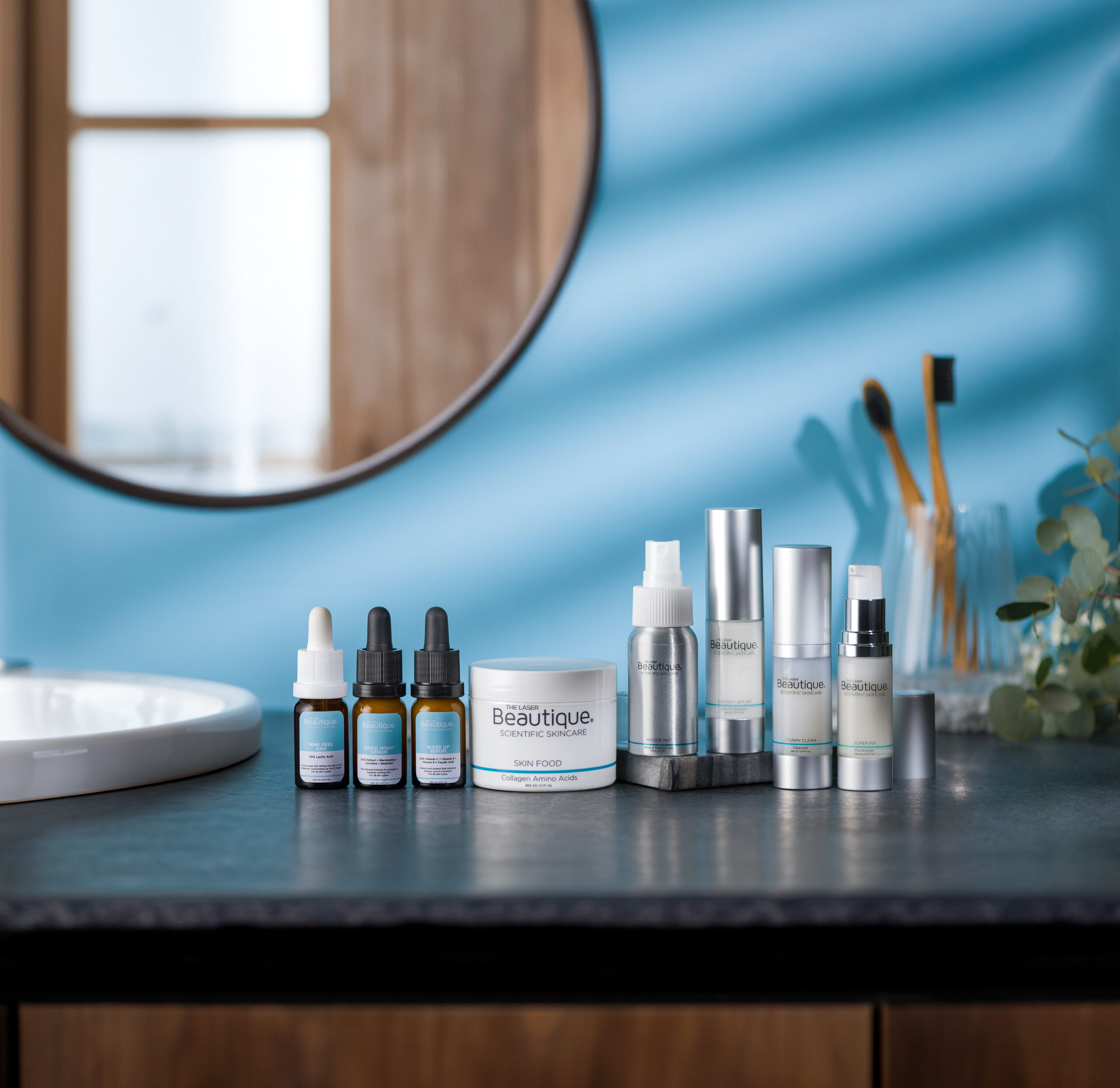 The Laser Beautique Scientific Skincare Starter Kit on a bathroom counter
