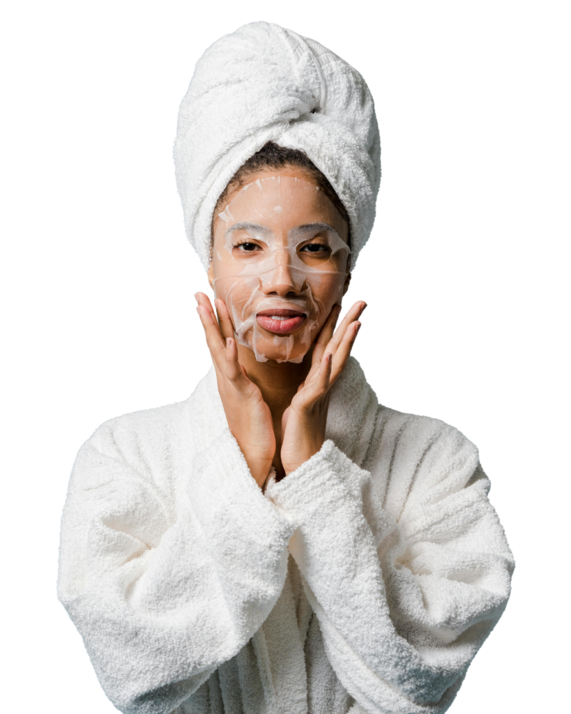 A mixed-race woman wearing the Scientific Skincare's Growth Factor Collagen Sheet Mask and a bathrobe